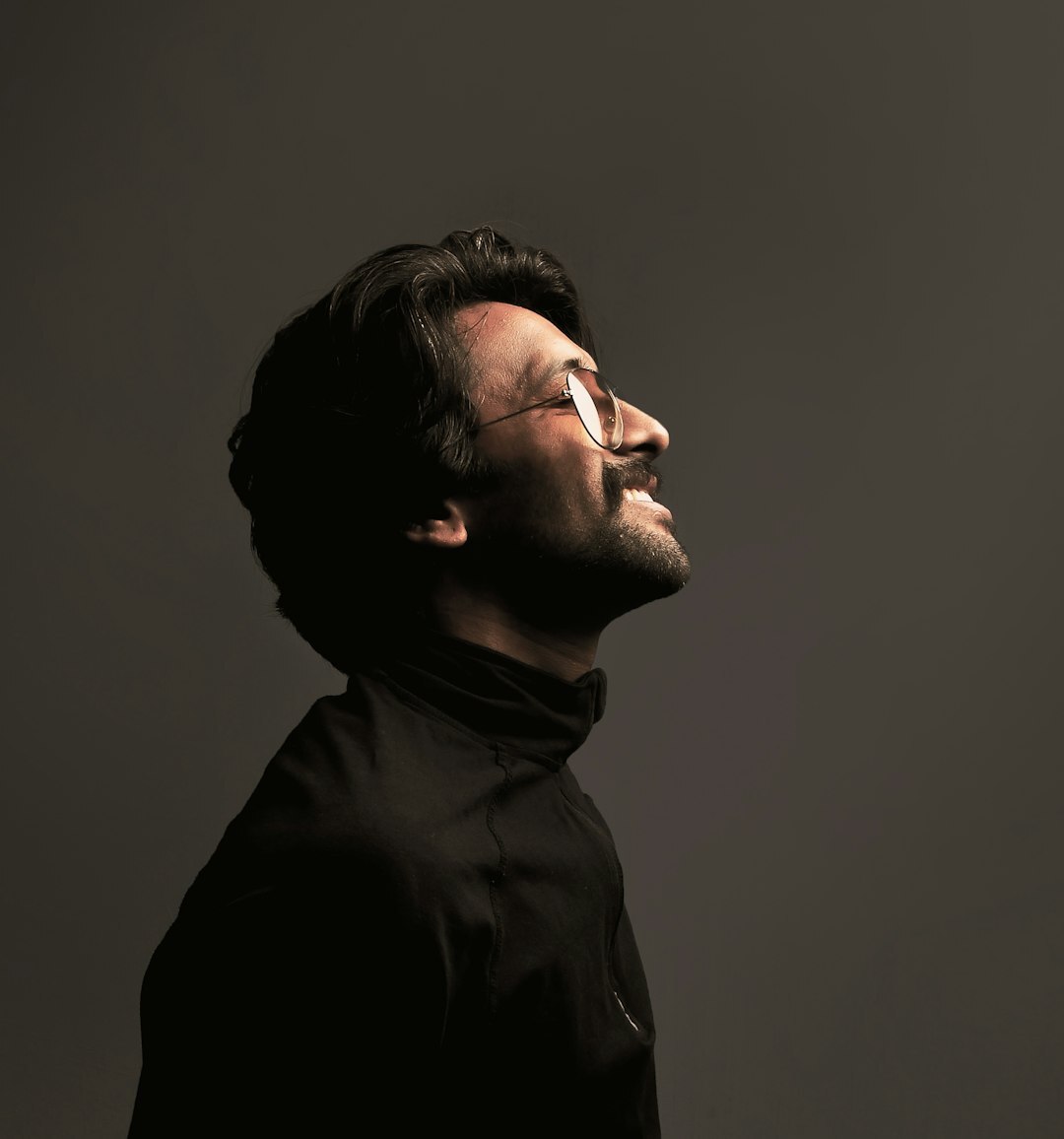 Studio portrait of a smiling middle aged Latino man